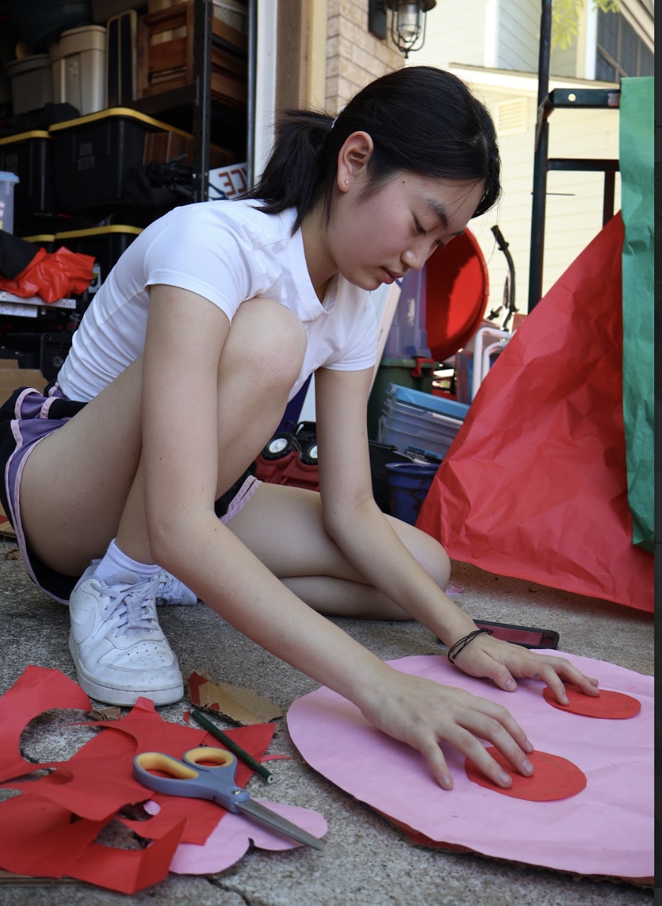 Engaged, StuCo Sophomore Class Secretary Yonnie Yang positions the blush for the Pokemon Igglypuff. Yang spent a total of eight hours volunteering at the Homecoming float-building event during the long weekend. "We did pretty well on float building this year," Yang said. "I really had an amazing time building with everyone and I hope Class of '27 is proud to see the float we worked hard for."